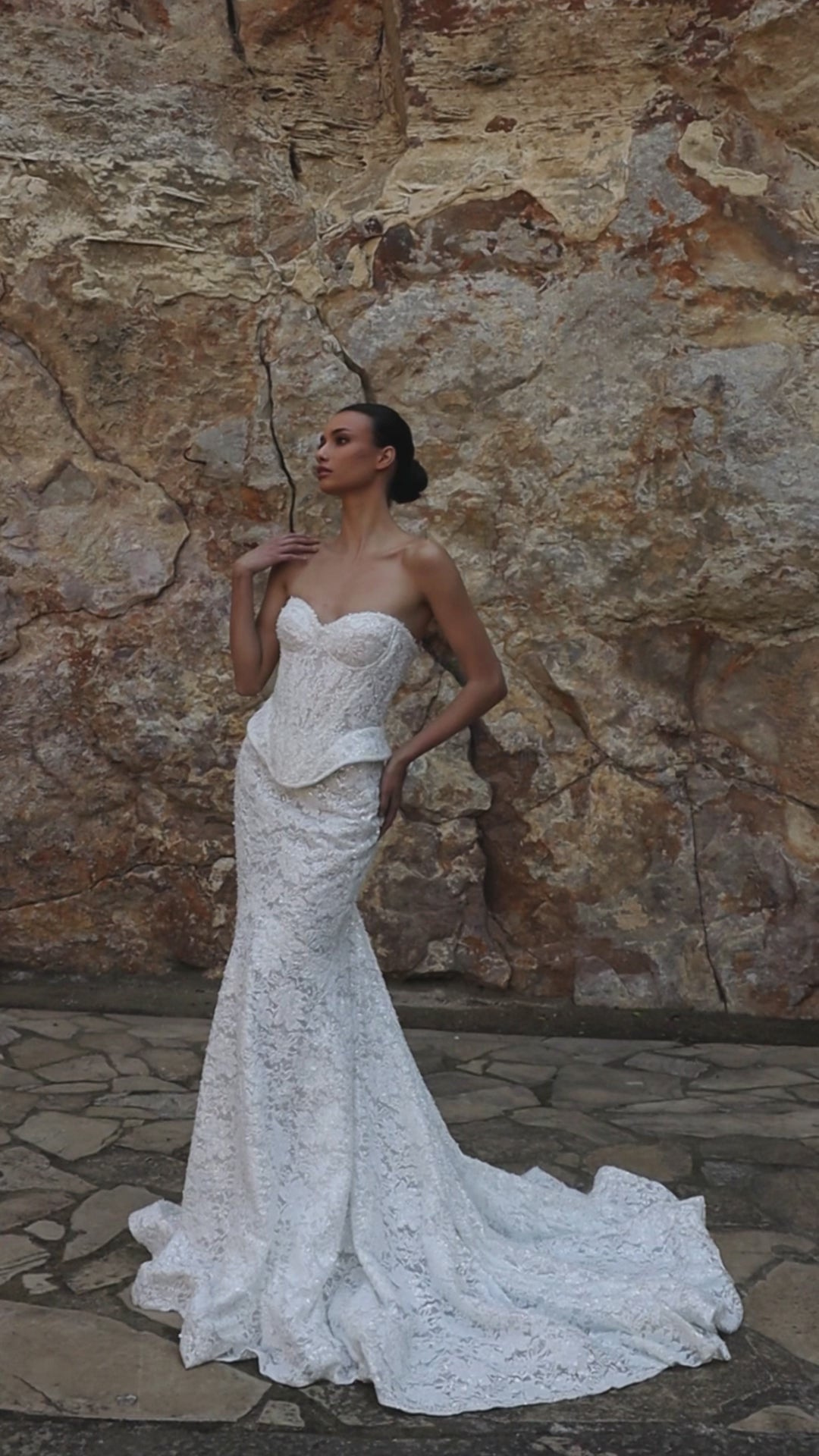 Mermaid wedding dress with sweetheart neckline, sleeveless pearl lace corset, longline bodice, and fishtail court train. Luxurious modern bridal gown.