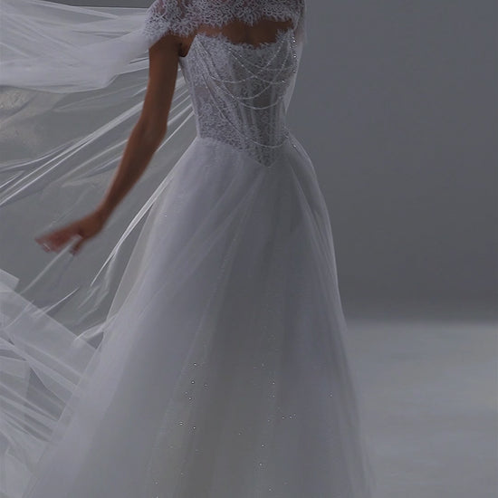 Tulle wedding dress with lace corset, sweetheart neckline and sheer cape – video
