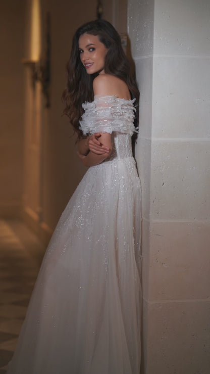 Princess tulle wedding dress with floral bolero and chapel train