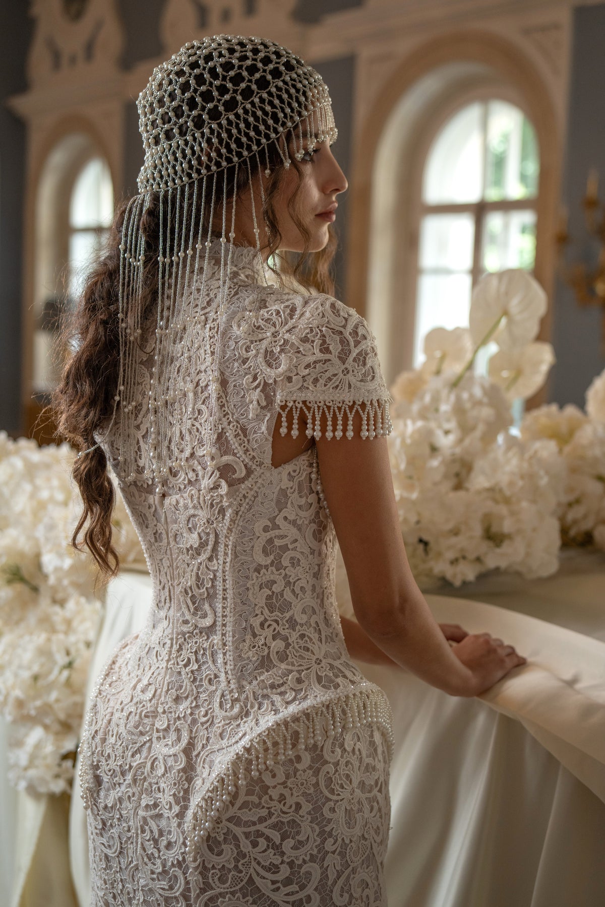Lace mini wedding dress with pearl fringe – back view with a beaded headpiece
