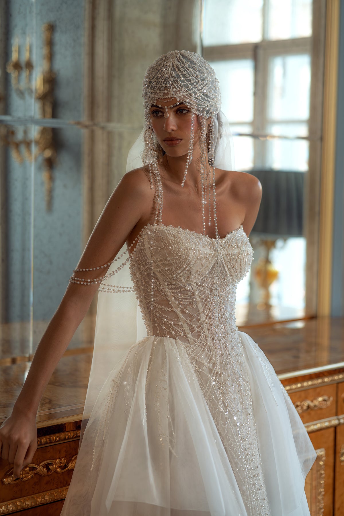 Beaded pearl corset wedding dress with spaghetti straps – close view of the corset and layered tulle skirt