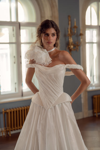 Taffeta ball gown wedding dress – close-up of the off-shoulder draped corset and fabric flower