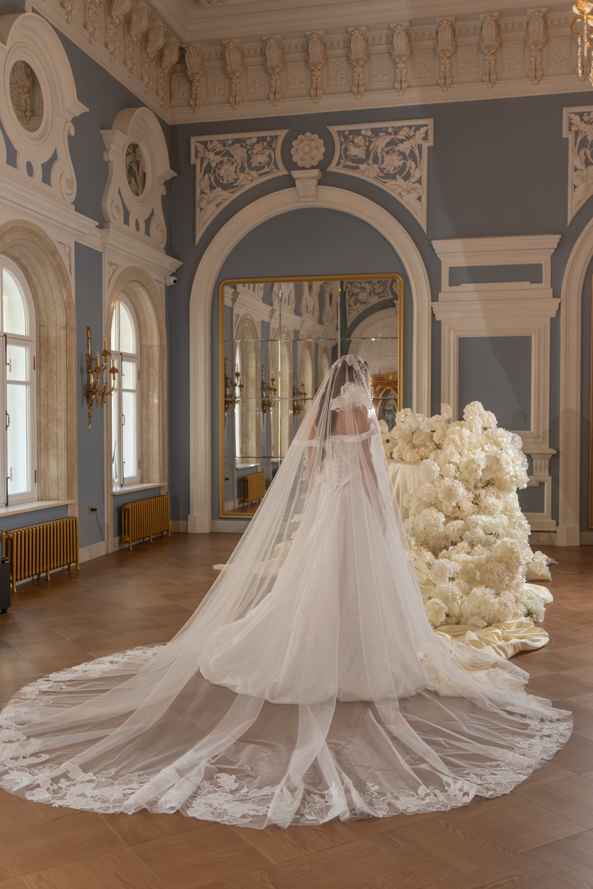 Taffeta ball gown wedding dress – the long cathedral veil spread across the floor