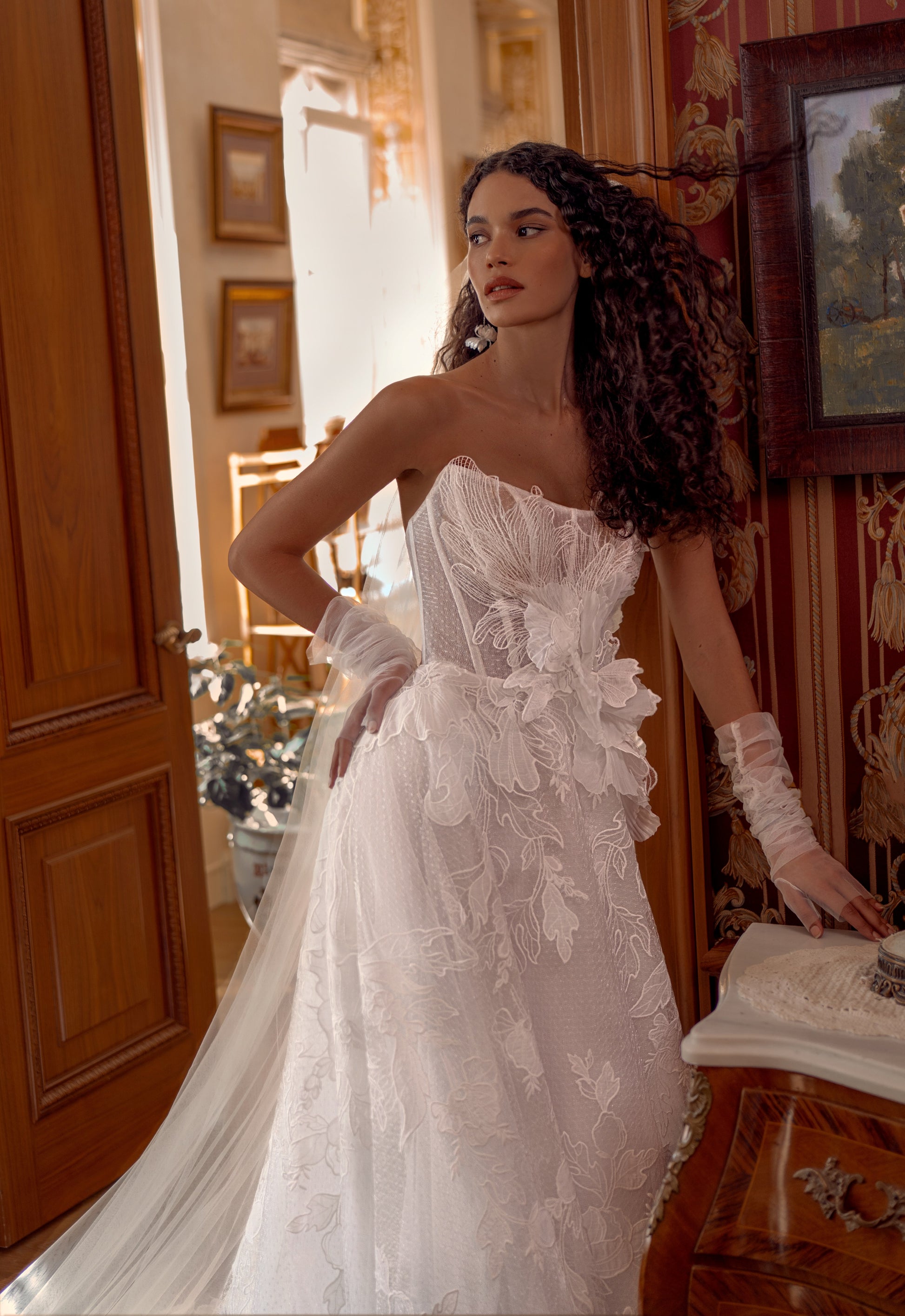 Romantic lace A-line wedding dress with floral appliqué and long tulle train