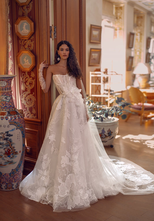 Romantic lace A-line wedding dress with floral appliqué and long tulle train