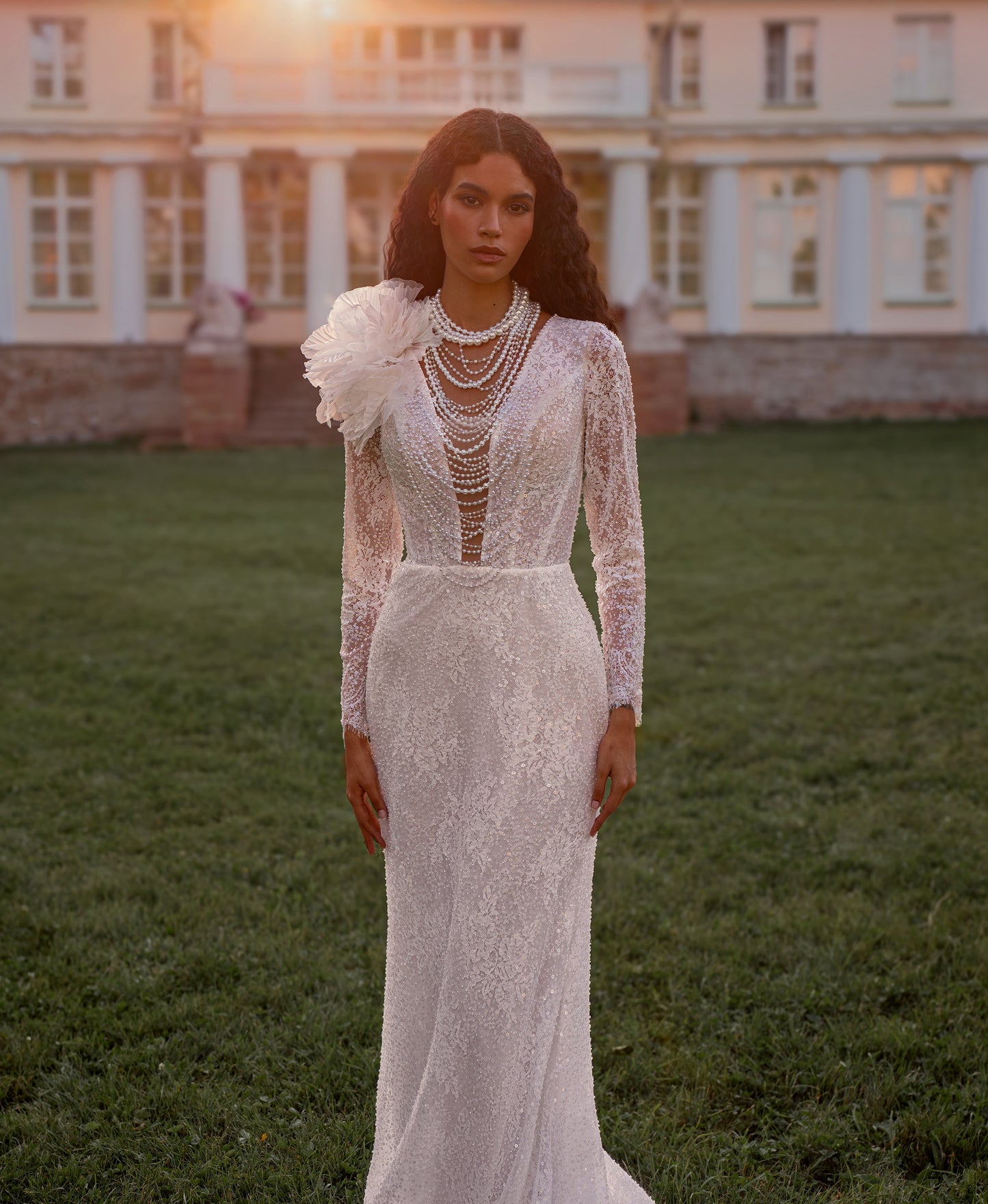 Bride wearing a sheath lace wedding dress with illusion neckline and detachable choker