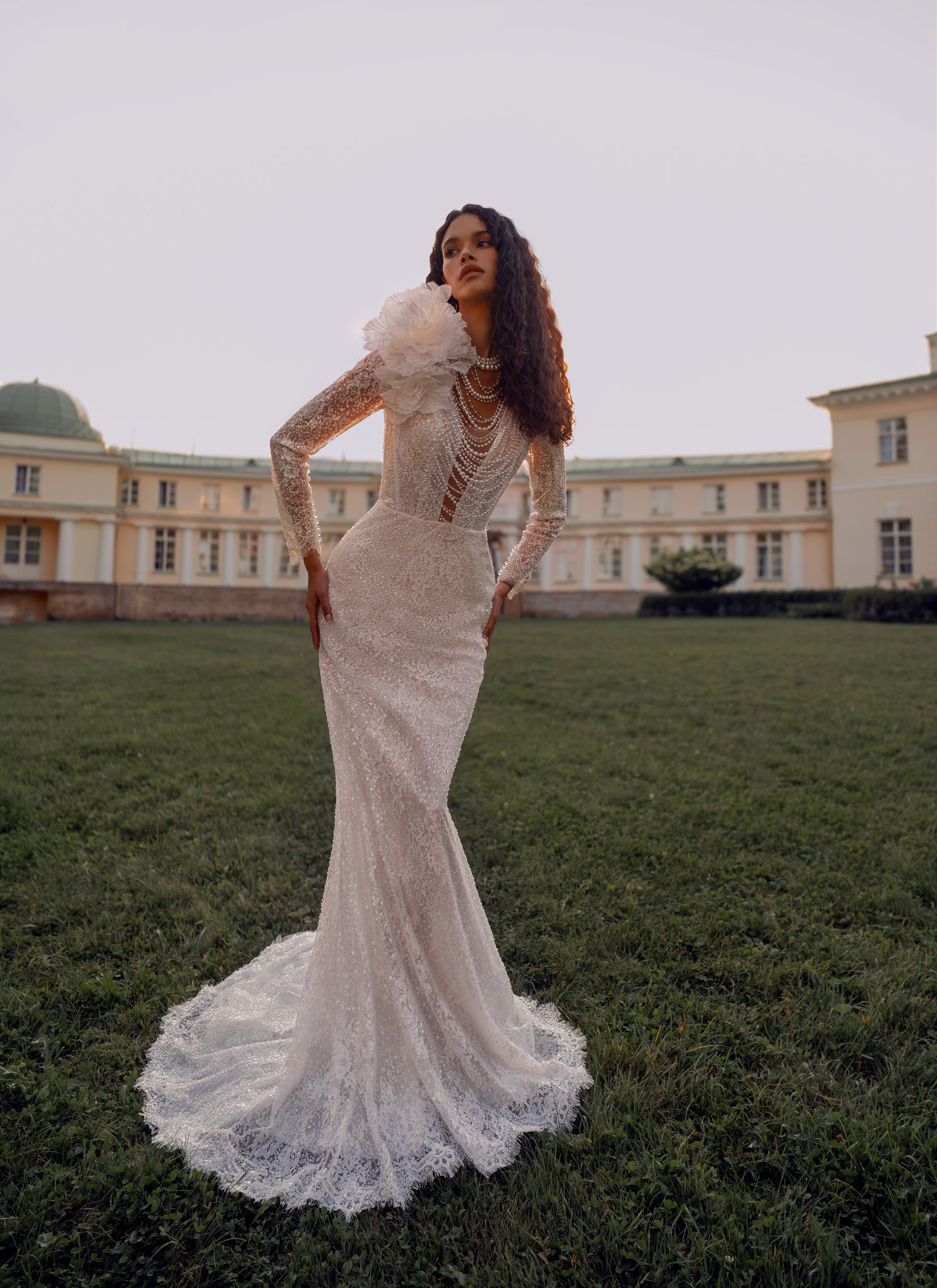 Bride wearing a sheath lace wedding dress with illusion neckline and detachable choker